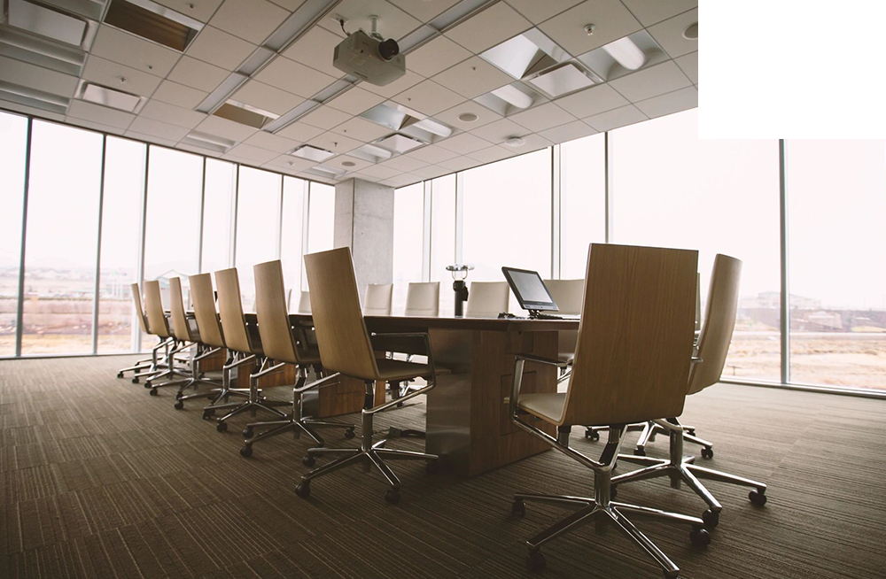 A conference room with chairs and tables in it